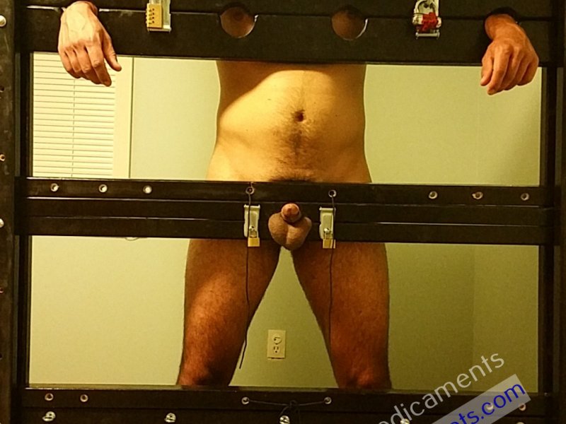 Bondage Sub Locked in Stocks