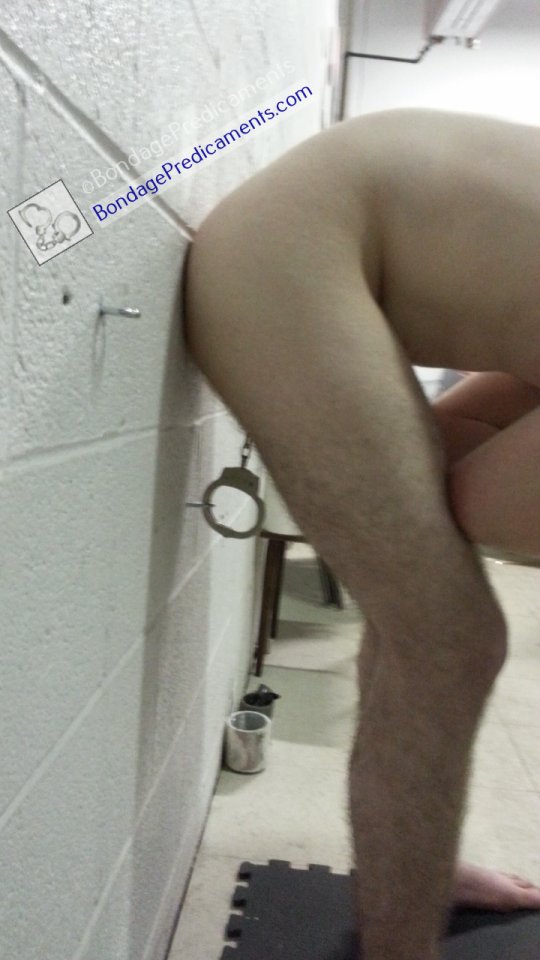 Balls Cuffed to Wall